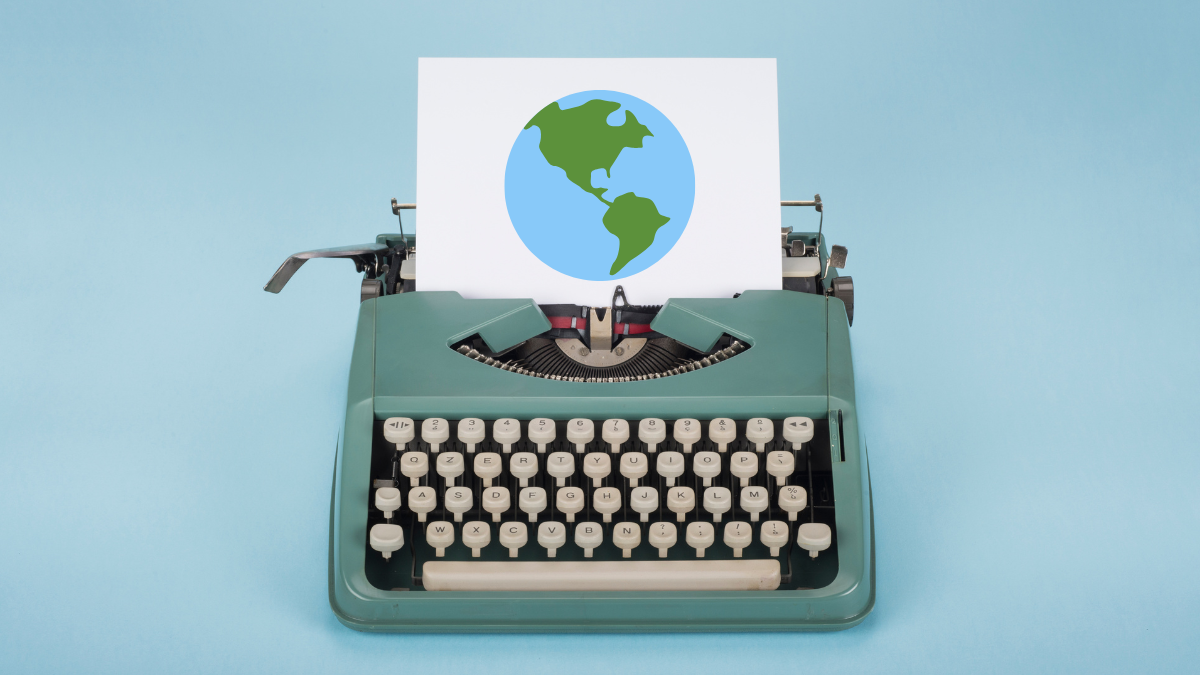 typewriter graphic with earth on piece of paper